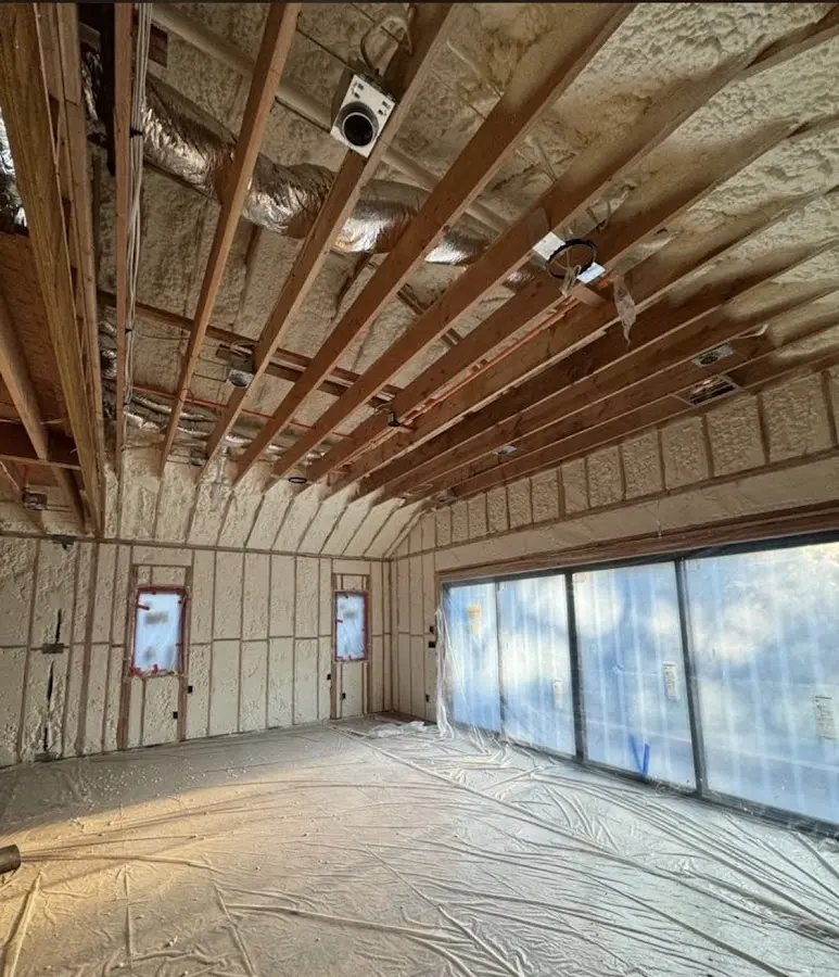 Interior walls and ceiling insulated with spray foam during new construction in Durham